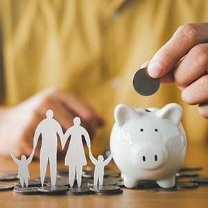 Patient saving money in piggy bank