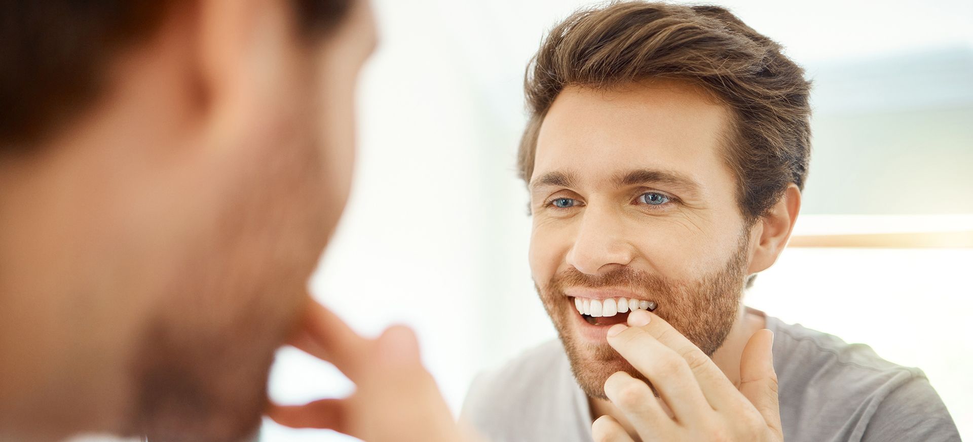 Patient in Loves Park smiling with new custom veneers