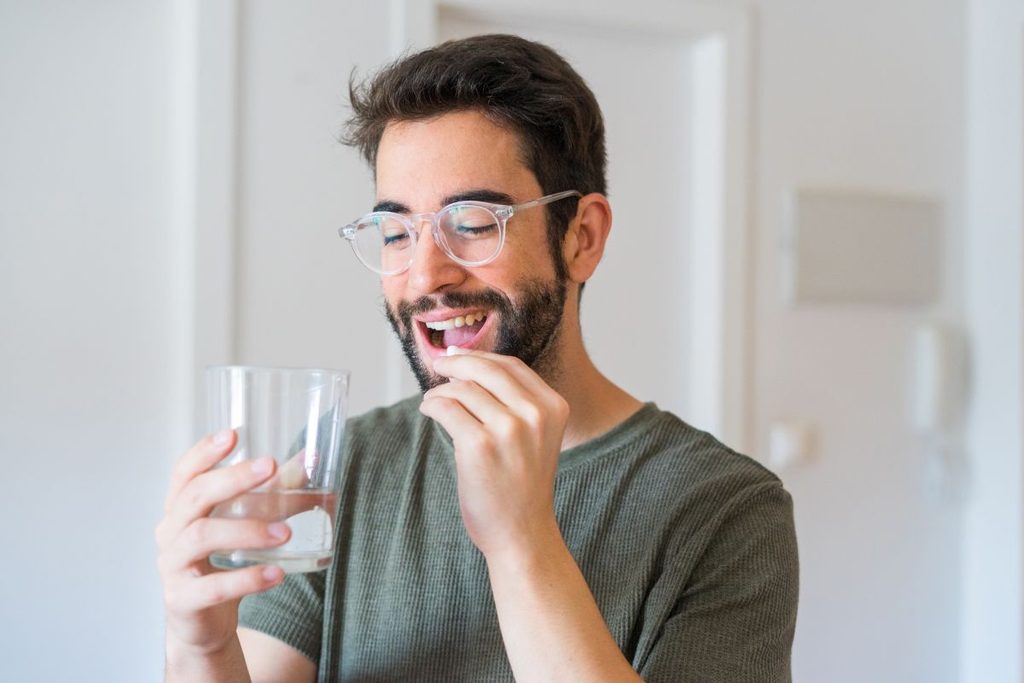 A man taking an oral sedative